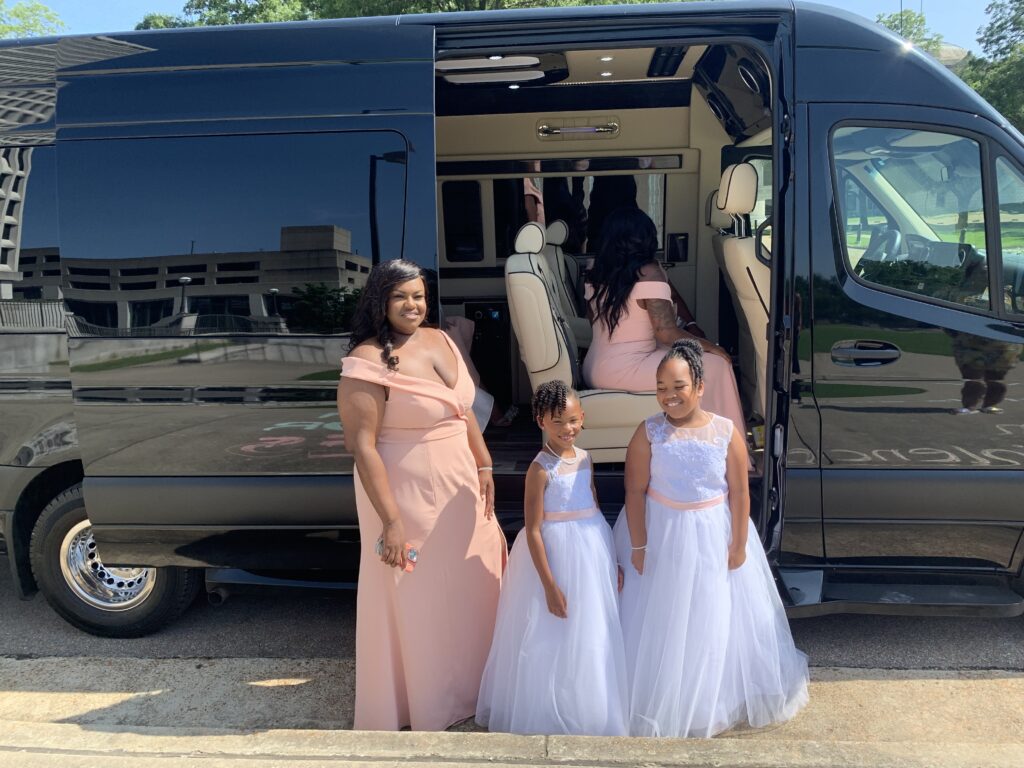 Bridal party entering a luxury limousine provided by Front Range Transit for their wedding day, highlighting the premium transportation service.